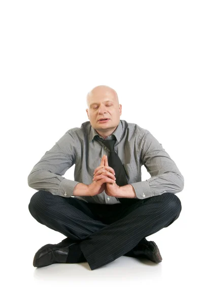 Affärsman mediterar i lotusställning — Stockfoto