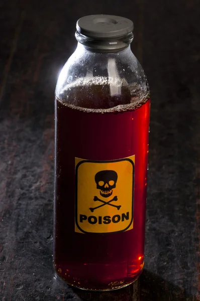 Poison bottle with label — Stock Photo, Image