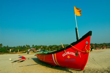 Boat on the Mandrem beach in Goa clipart