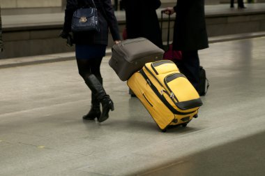 Travelers in motion rushing through an platform clipart
