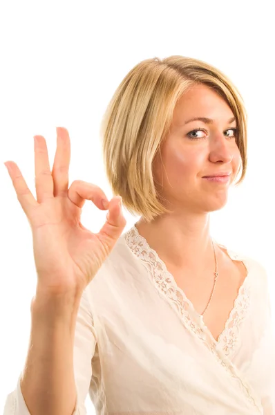 Uma mulher mostra um gesto ok em um fundo branco . — Fotografia de Stock