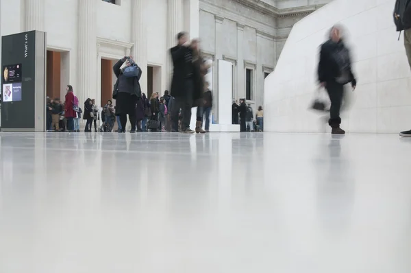 Blurred view of busy peoples legs walking — Stock Photo, Image
