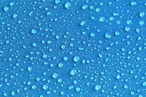 stock image Water drops on a blue surface