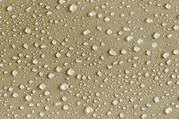 Water drops on a gold surface — Stock Photo, Image
