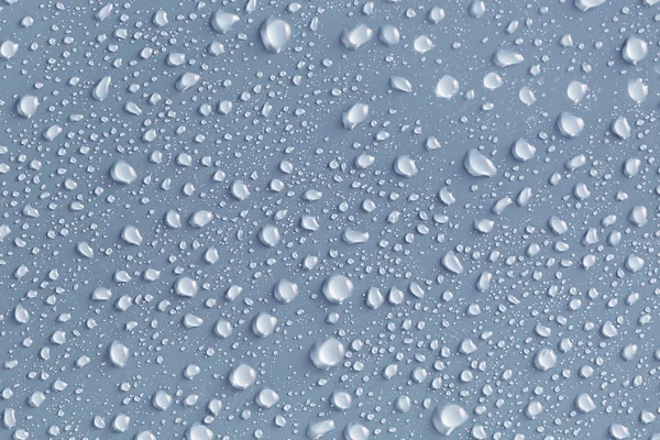 Water drops on a gray surface — Stock Photo, Image