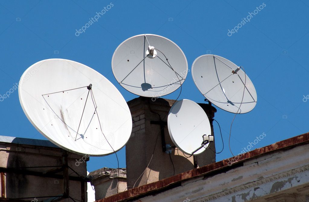 Four satellite dish antennas