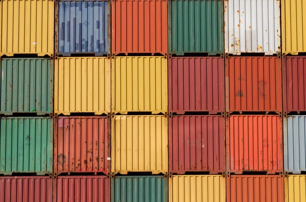 stock image Colorful ship cargo containers stacked up in a port.