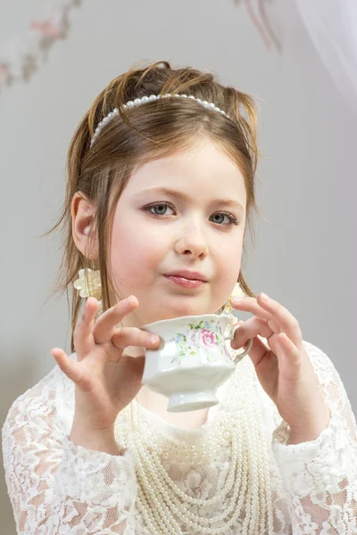A beautiful little girl having a tea party — Stock Photo, Image