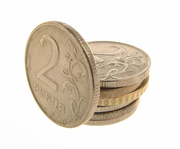 Монеты на белом — стоковое фото