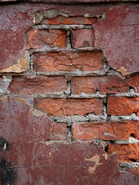 Weathered manchado pared de ladrillo viejo — Foto de Stock