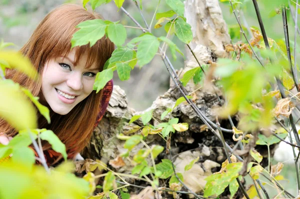 Redheaded girl in forest — Stock Photo, Image