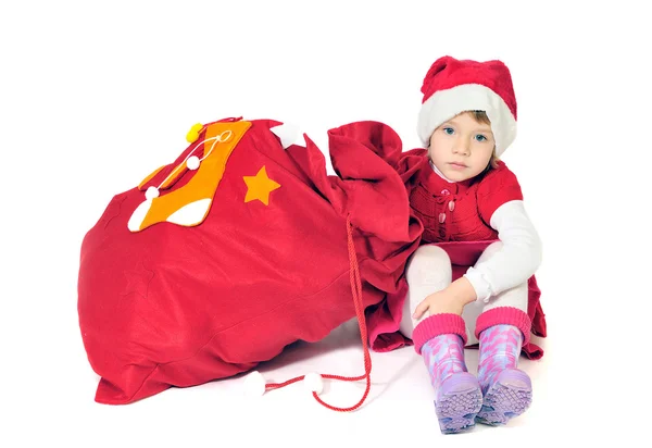 Os presentes formam o pequeno Papai Noel — Fotografia de Stock