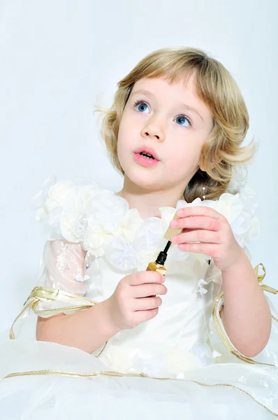 Princess girl playing with lipstick — Stock Photo, Image