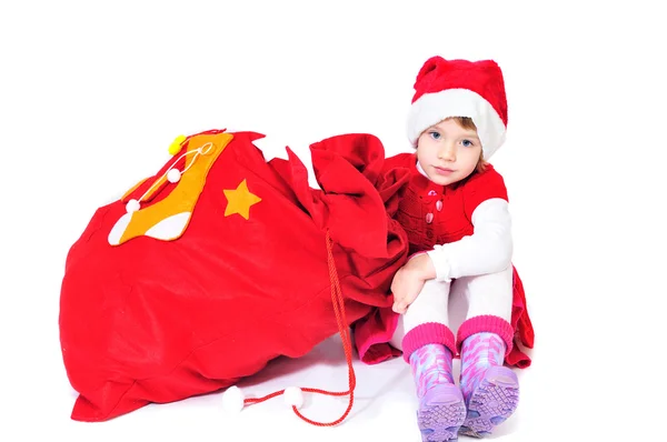 Santa helper with bag of gifts — Stock Photo, Image