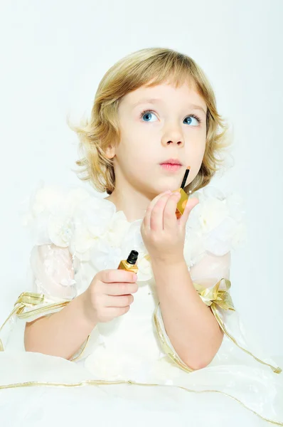 Girl playing with lipstick — Stock Photo, Image