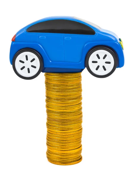 Spielzeugauto und Stapel von Münzen — Stockfoto