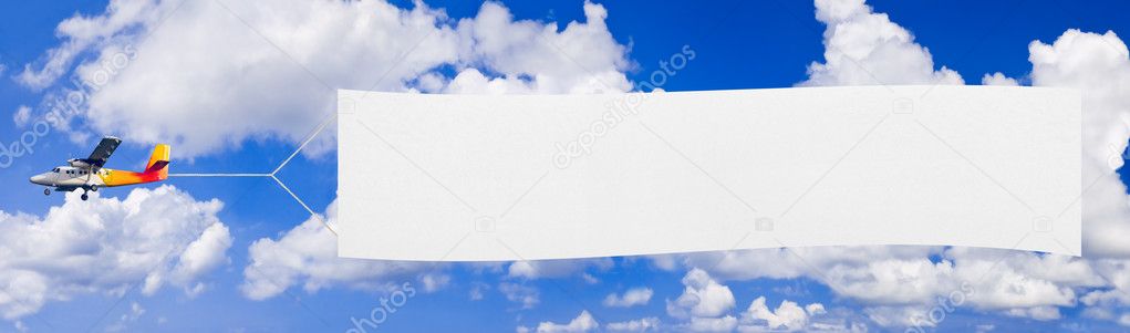 Flying airplane and banner