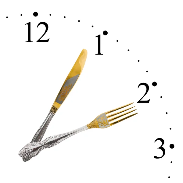 Klokken er laget av gaffel og kniv – stockfoto