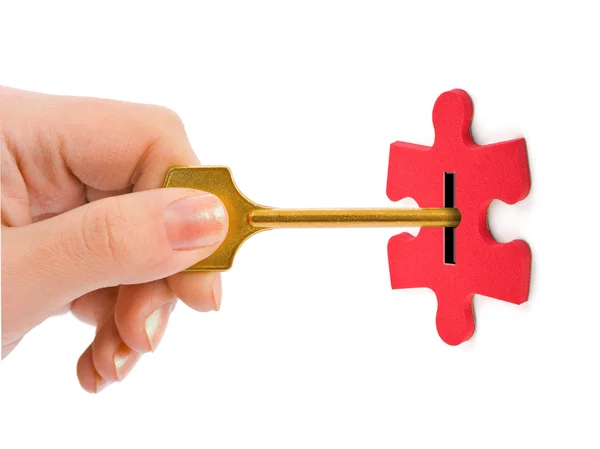 stock image Hand with key and puzzle