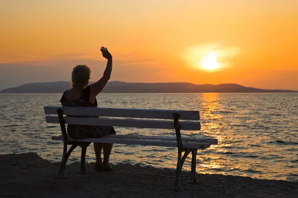Woman and sunset — Stock Photo, Image