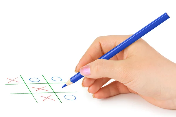 Hand med penna och spel — Stockfoto