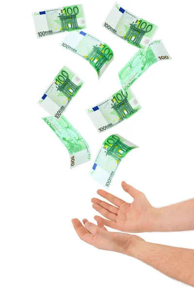 Mão e dinheiro caindo — Fotografia de Stock
