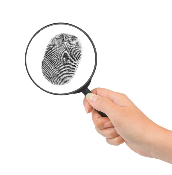 Magnifying glass in hand and fingerprint — Stock Photo, Image