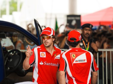 SEPANG, MALAYSIA - APRIL 10: Fernando Alonso and Felipe Massa (F clipart