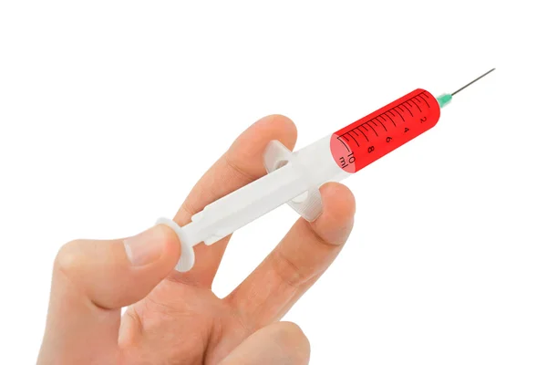 Syringe in hand Stock Picture