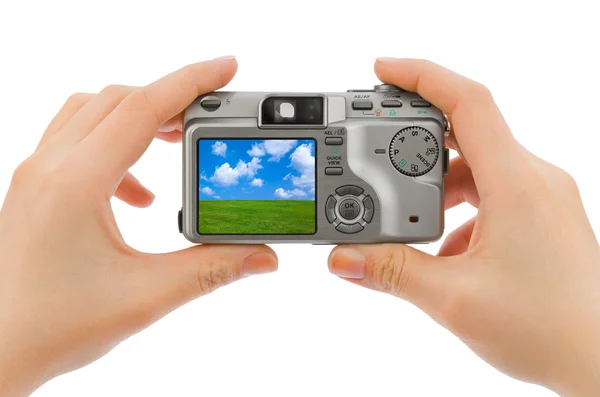 Photo camera in hands and landscape (my photo) — Stock Photo, Image