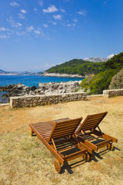 Chairs on beach at Dubrovnik, Croatia clipart