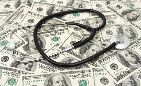 Stethoscope on money background — Stock Photo, Image