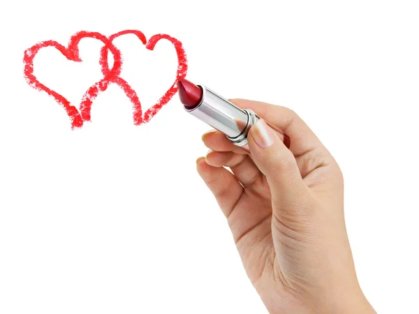 Hand with lipstick drawing hearts — Stock Photo, Image