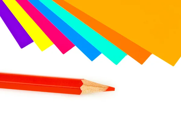 Veelkleurige papier en potlood — Stockfoto
