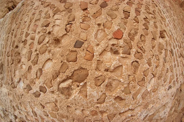Convex ancient stone wall texture shot with fisheye — Stock Photo, Image
