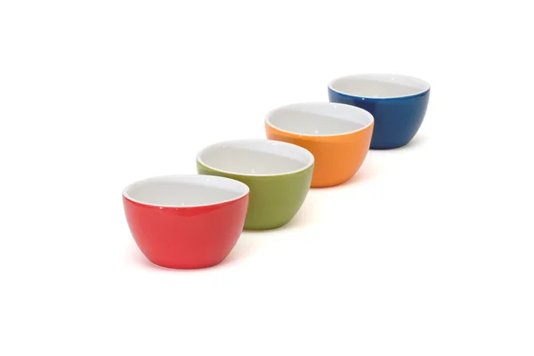 Diagonal row of four porcelain bowls isolated — Stock Photo, Image