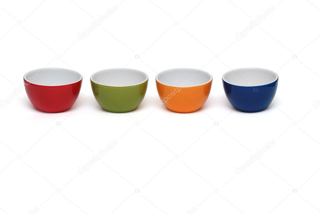 Row of four porcelain bowls isolated