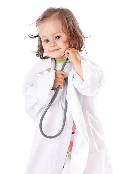 Küçük bir kız doktor oynuyor Stok Fotoğraf