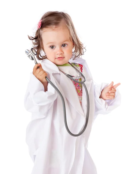 A little girl is playing as a doctor — Stock Photo, Image