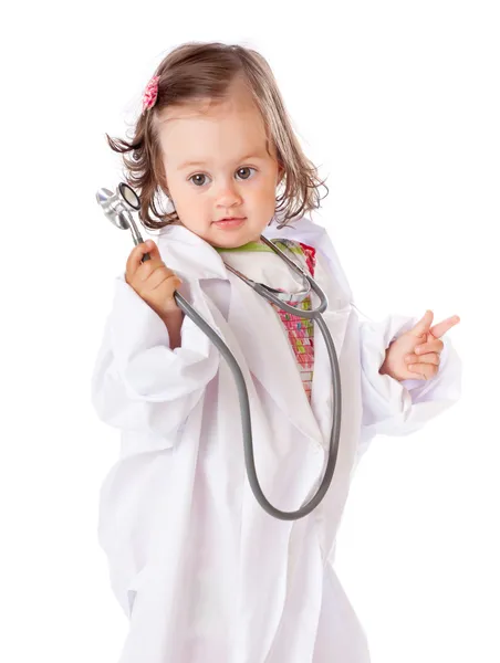 Ein kleines Mädchen spielt als Ärztin Stockbild