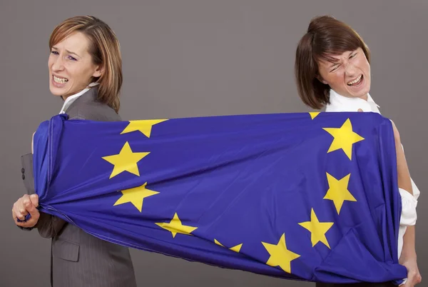 Women pulling on european flag — Stock Photo, Image