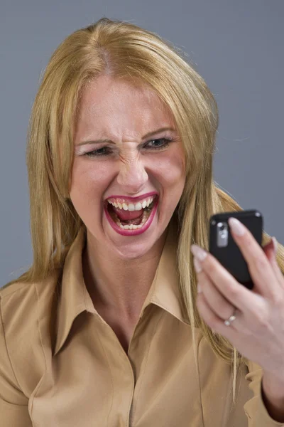 Woman screaming at phone — Stock Photo, Image