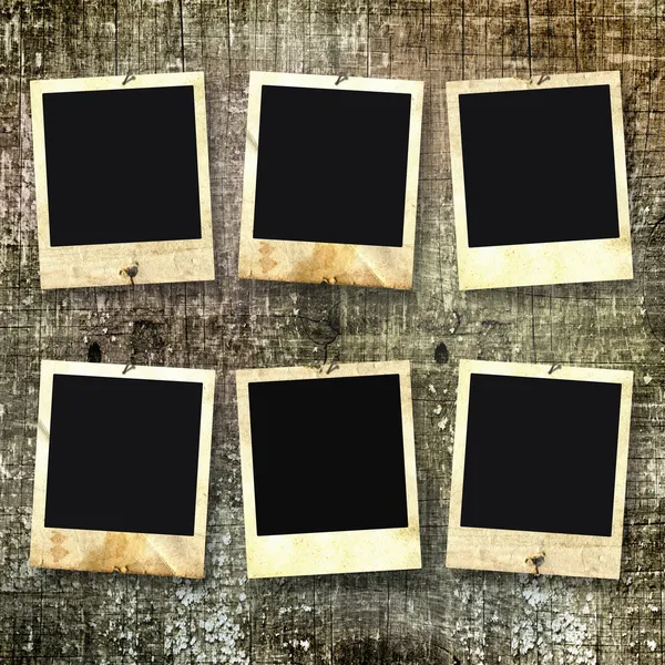 Old photoframes are hanging on the vintage background. — Stock Photo, Image