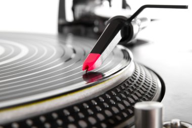 Turntable playing vinyl with music clipart