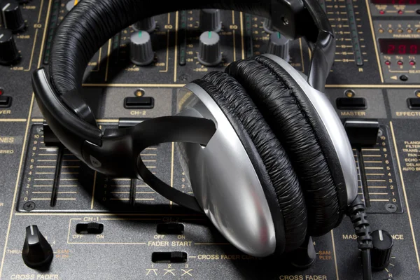 Dj headphones on mixer — Stock Photo, Image