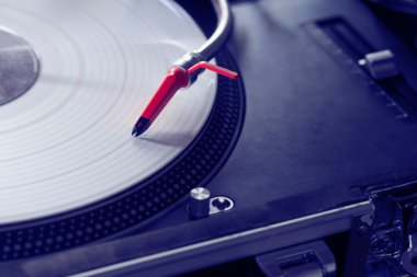 Professional turntable playing vinyl record clipart