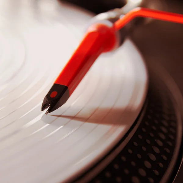 Professional turntable playing vinyl record — Stock Photo, Image