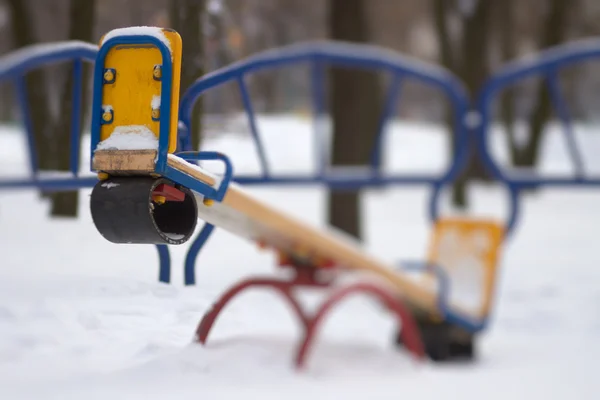 Seesaw playground in snow — Stock Photo, Image