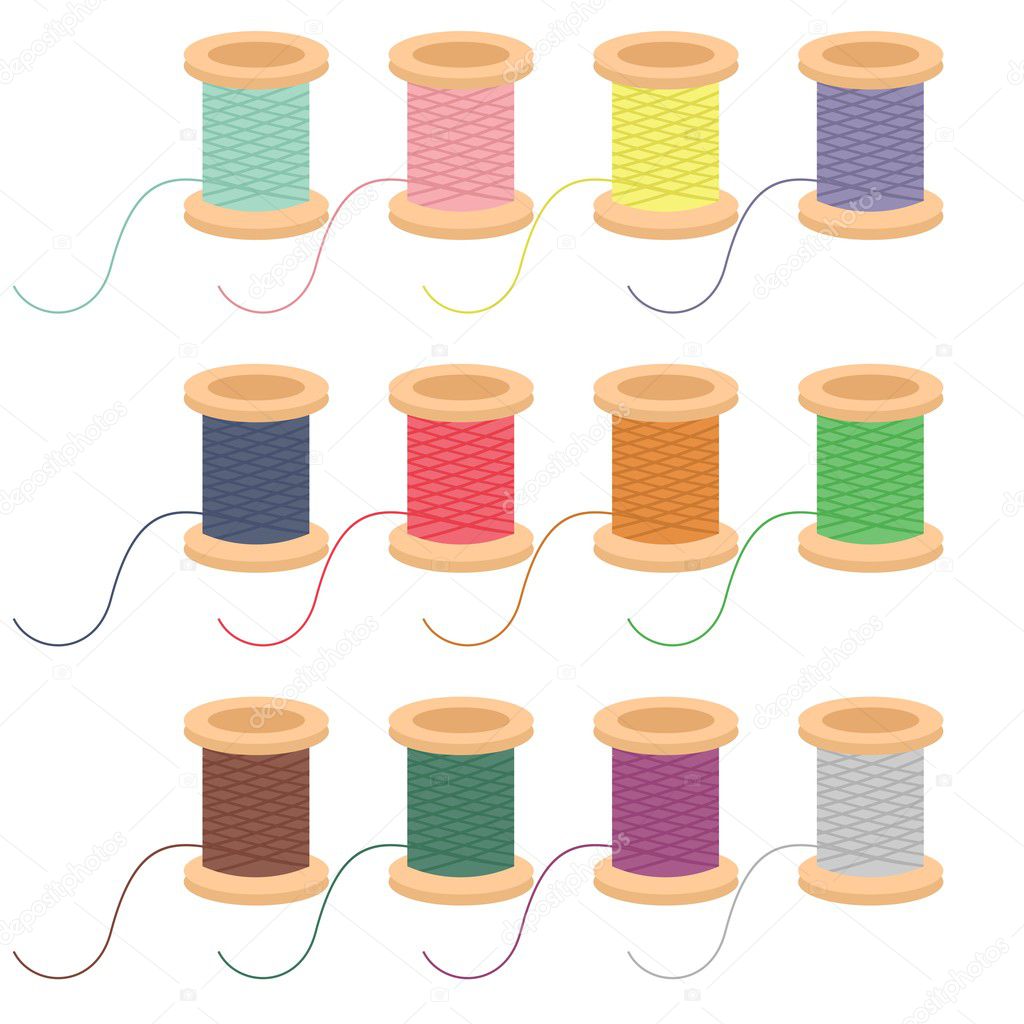 Colored reels of thread on white background
