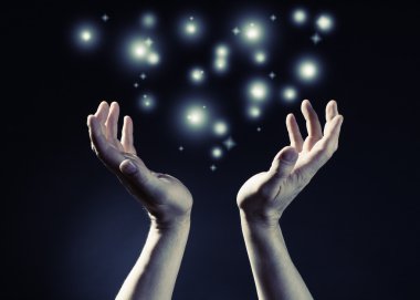 Hands joined together with glow light clipart